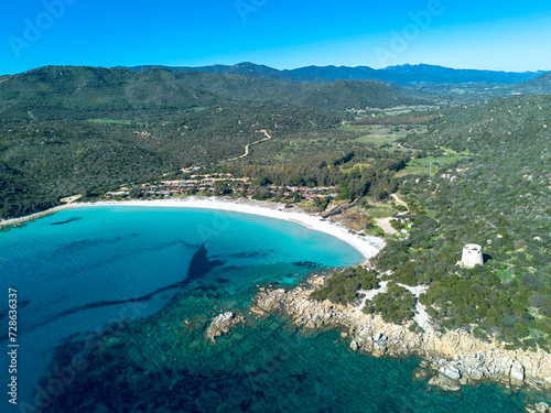 Cala Pira beach and tower, with white sand and crystal clear water seen from above with drone. Castiadas, Sardinia, Italy photo