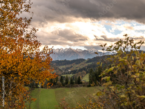 Fototapeta Naklejka Na Ścianę i Meble -  view of the mountains from another mountain in autumn	