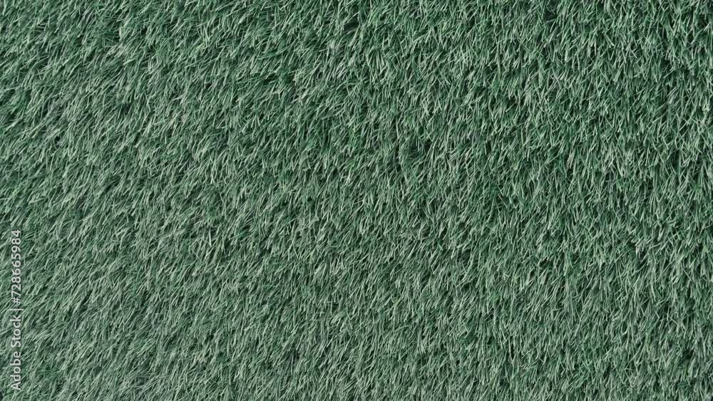 Green grass texture. Artificial grass background. Lawn in backyard. Garden backdrop. Vibrant color closeup macro pattern Green grass texture. Artificial grass background. Lawn in backyard. Garden backdrop. Vibrant color closeup macro pattern