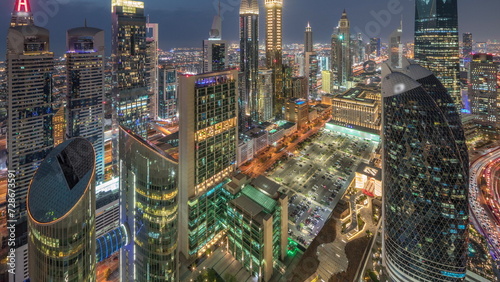 Skyline view of the high-rise buildings on Sheikh Zayed Road in Dubai aerial day to night timelapse  UAE.