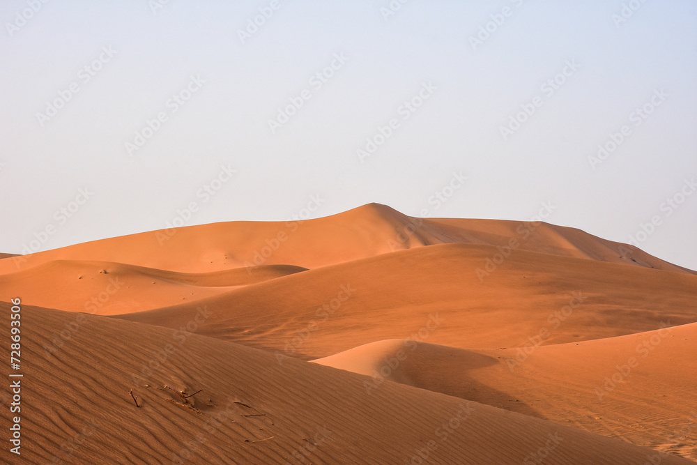 Scenic view of desert against clear sky in Al Ain, Abu Dhabi, UAE.