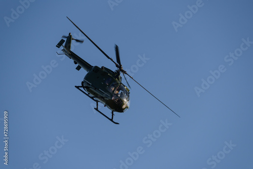 HELICOPTER - Machine against the background of blue sky 