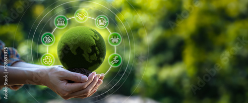 Hand holding green globe with network connection and ESG(environmental,social,governance),sustainable business,renewable resource to reduce pollution,Save world save life and Plant a tree concept.