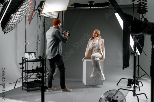 Photographer and fashion model in studio for creative art, clothes brand and designer social media blog