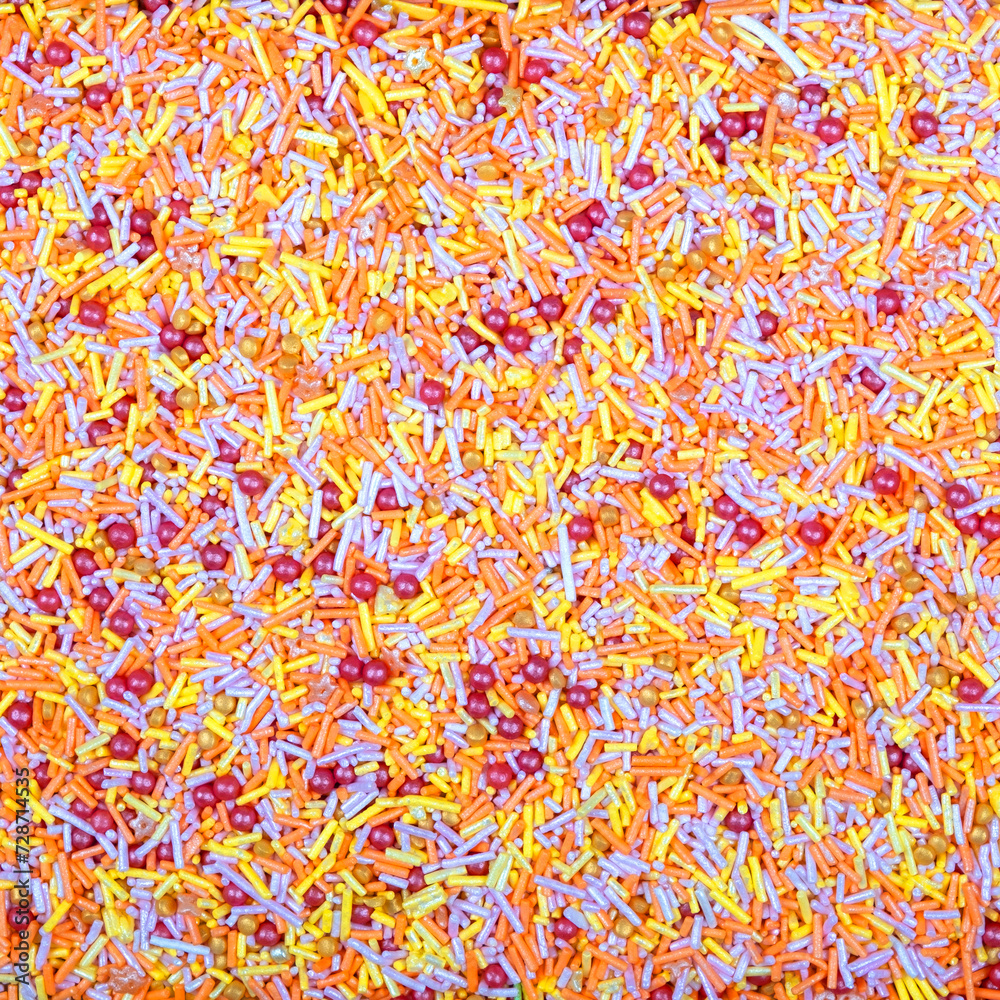 Fototapeta premium Colorful and bright cake decorations, in powder and granule form, can also be used as a colorful background.