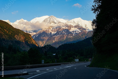 Obraz na płótnie Mont Blanc above highway, highest mountain in Alps and Western Europe with elevation 4809 m, popular climbing mountain lies between France and Italy w salonie