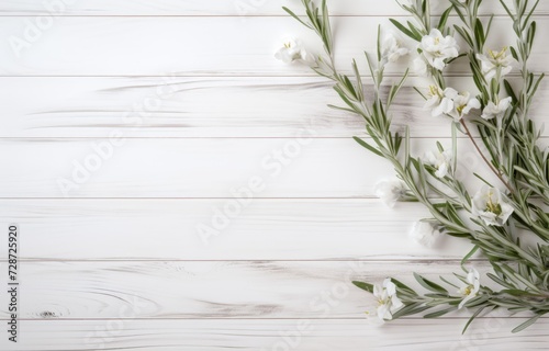 A collection of white flowers peacefully arranged on a sturdy wooden table.