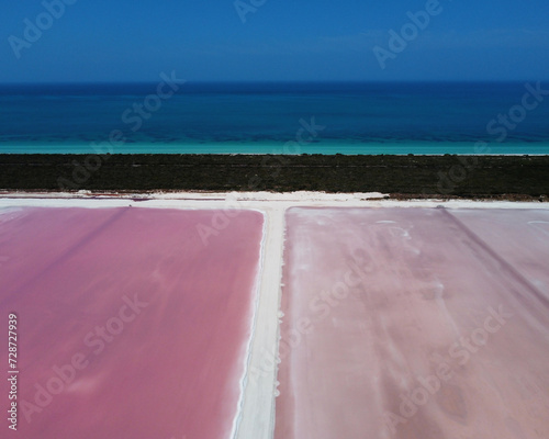 aerial view of pink salt lake and Caribbean sea at Las Coloradas in Mexico. Travel concept photo