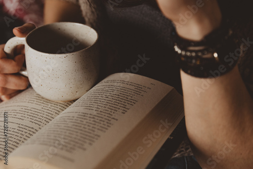 woman with book and cup of coffee