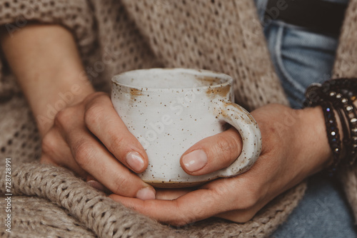 woman with book and cup of coffee