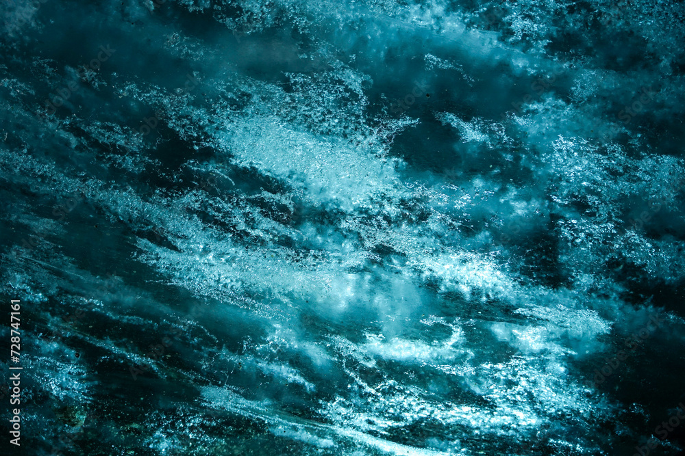 Close up view of strong blue ice inside glacier ice cave