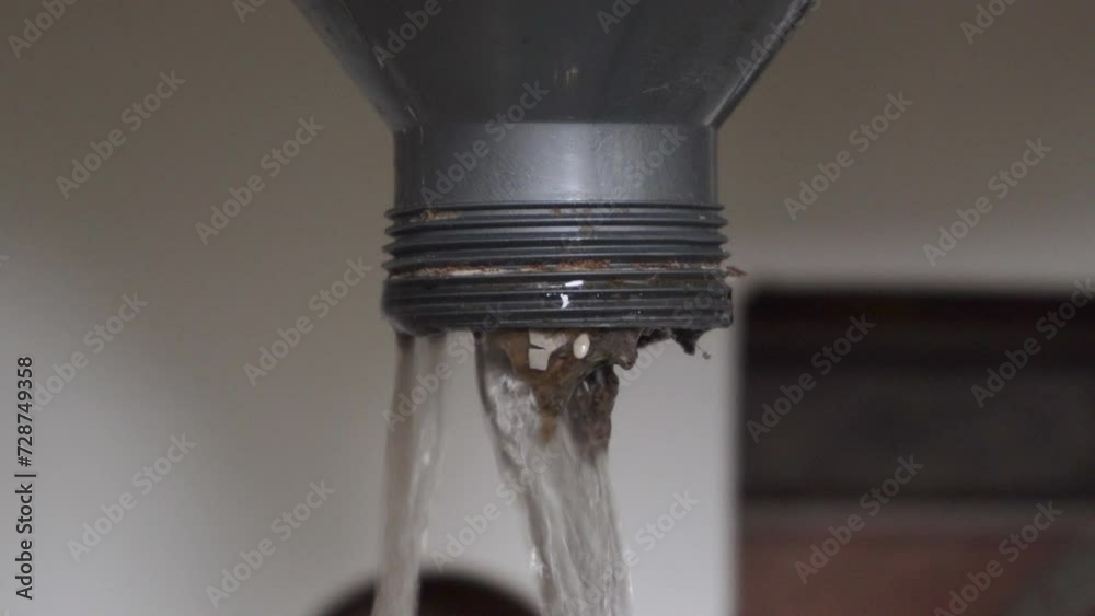 water flows from under the sink, clean the clogged hole in the sink, dirty water flows from under the sink in the kitchen water flows from under the sink, clean the clogged hole in the sink, dirty water flows from under the sink in the kitchen