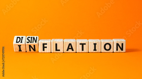 Inflation or disinflation symbol. Concept word Inflation Disinflation on beautiful wooden cubes. Beautiful orange table orange background. Business inflation disinflation concept. Copy space.