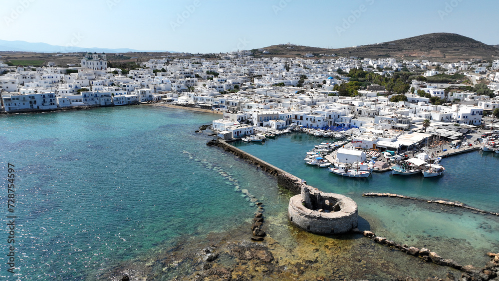 Aerial drone photo from picturesque small seaside village of Naoussa with traditional Cycladic character, Paros island, Cyclades, Greece