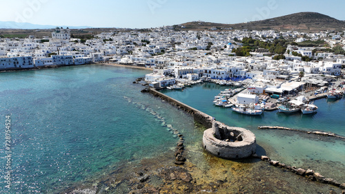 Aerial drone photo from picturesque small seaside village of Naoussa with traditional Cycladic character, Paros island, Cyclades, Greece