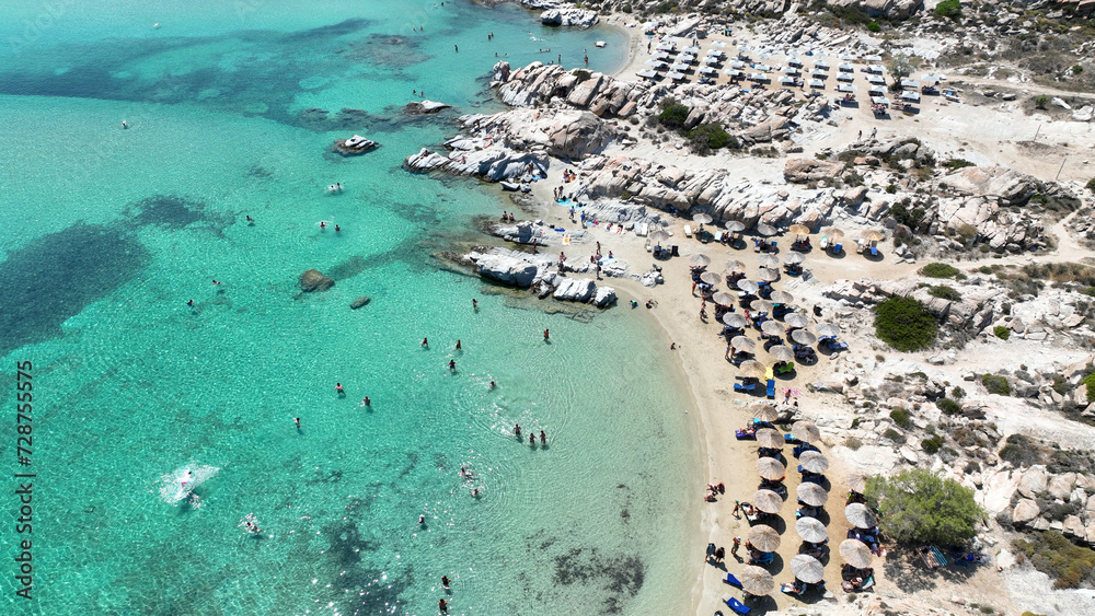 Aerial drone photo of famous small organised beach with unique rock formations of Kolimbithres or Kolympithres in the gulf of Naousa, Paros island, Cyclades, Greece