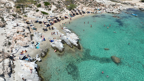 Aerial drone photo of famous small organised beach with unique rock formations of Kolimbithres or Kolympithres in the gulf of Naousa, Paros island, Cyclades, Greece