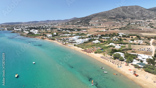 Aerial drone photo of famous for surfers sandy beach of Chrysi Akti or Golden beach with crystal clear emerald sea calm with no wind, Paros island, Cyclades, Greece
