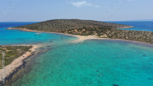 Aerial drone photo of azure paradise blue lagoon of Panteronisi a small islet complex between Paros and Antiparos islands visited by yachts and sail boats, Cyclades, Greece