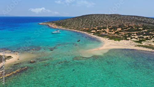 Fototapeta Naklejka Na Ścianę i Meble -  Aerial drone photo from tropical exotic paradise secluded rocky island bay with deep turquoise and sapphire sea forming a blue lagoon visited by yachts and sailboats in Caribbean exotic destina