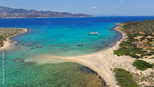 Fototapeta Naklejka Na Ścianę i Meble -  Aerial drone photo from tropical exotic paradise secluded rocky island bay with deep turquoise and sapphire sea forming a blue lagoon visited by yachts and sailboats in Caribbean exotic destina