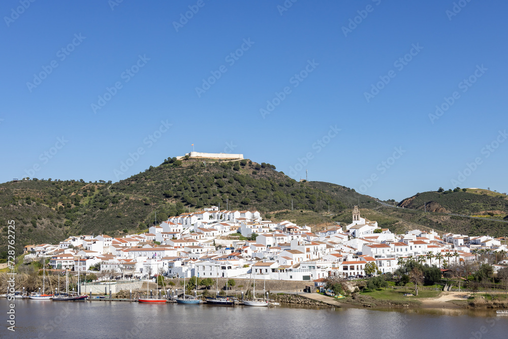 Panoramic view of Sanlucar de Guadiana village in Huelva, Andalusia, on the banks of Guadiana river, in the border of spain with portugal, in front of the portuguese village of Alcoutim in Algarve