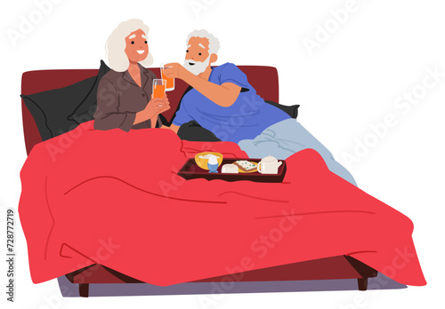 Senior Couple Smiles As They Clink Juice Glasses In Soft Morning Light. Characters Savoring A Cozy Breakfast In Bed