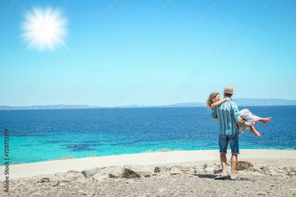 A happy couple near the seashore in nature weekend travel