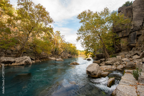 Transparent waters of Kopru River (Köprüçay, ancient Eurymedon) with its emerald green colour in Koprulu Canyon (Köprülü Kanyon) National Park, Antalya, Turkey. It's a rafting paradise photo