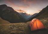 camping tent high in the mountains at sunset