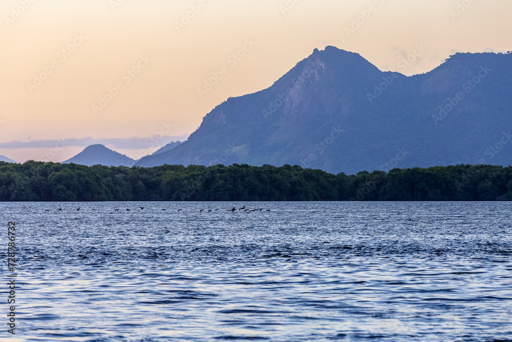 View of Mestre Álvaro, the highest mountain in the city of Serra-ES, during a beautiful late afternoon from Ilha das Caieiras, in Vitória.