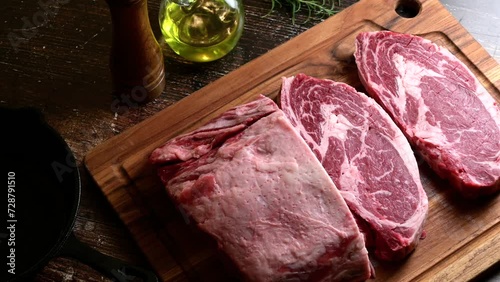 chunk of ribeye steak on wooden board