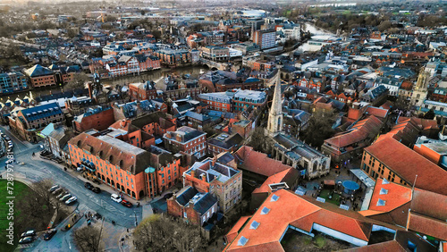 Aerial view of a historic town at dusk with warm lighting, showcasing the urban architecture and streets in York, North Yorkshire photo