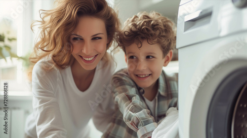 Caucasian mother and son washing clothes together in the house.