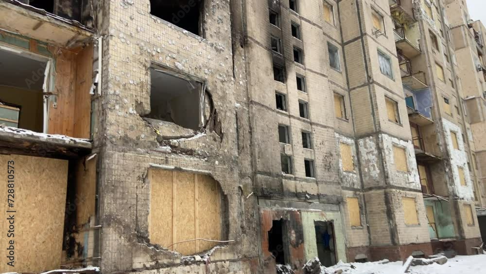A damaged house in the city of Kyiv, Ukraine after a Russian missile attack. Burnt apartments, windows and doors, burnt wood. Burnt high-rise building. Consequences of war. High quality 4k footage A damaged house in the city of Kyiv, Ukraine after a Russian missile attack. Burnt apartments, windows and doors, burnt wood. Burnt high-rise building. Consequences of war. High quality 4k footage
