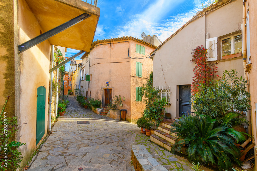 A narrow alley and street of homes in Ramatuelle, France, a picturesque French Village in the Var Dept. of the Provence, Alpes Cote d'Azur region.