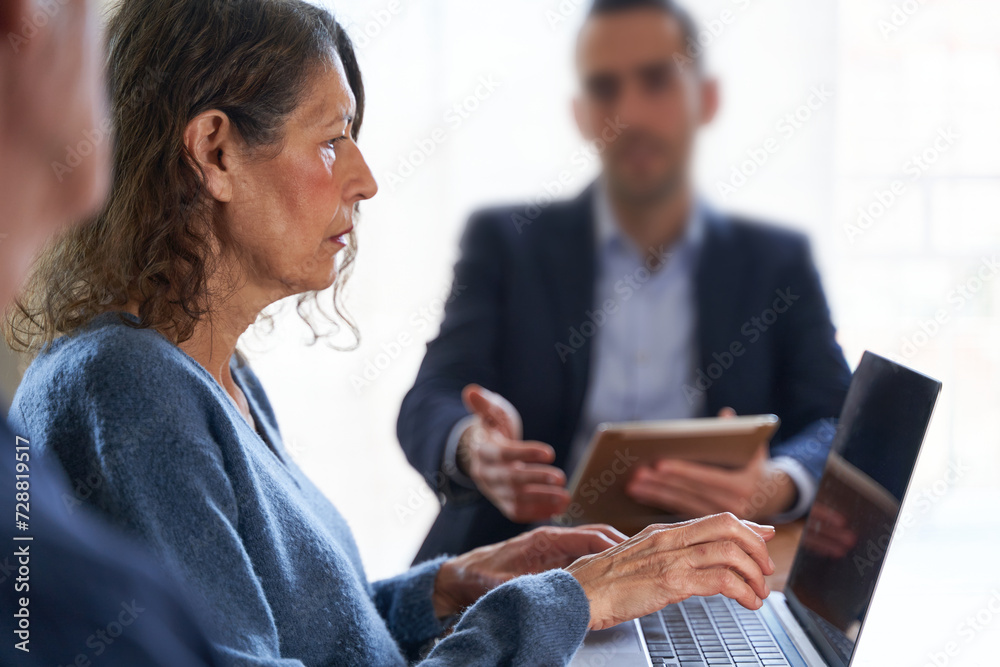 Misoginy and ageism in business. Mature female scolded by young male boss Misoginy and ageism in business. Mature female scolded by young male boss