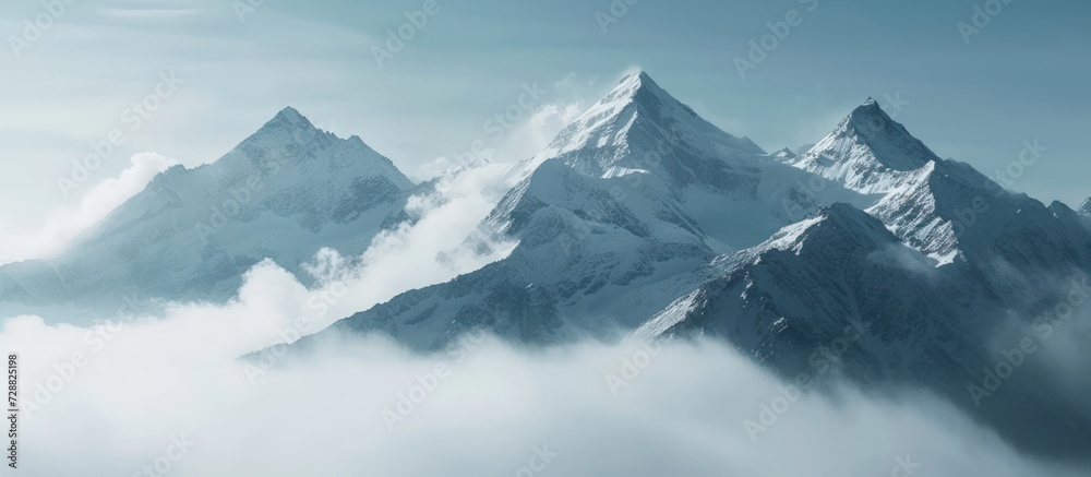 Beautiful landscape of majestic mountain peaks summits with snow capped with cloudy. AI generated