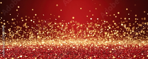 a vibrant red background overlaid with a multitude of sparkling golden particles that create a glittering and magical atmosphere.
