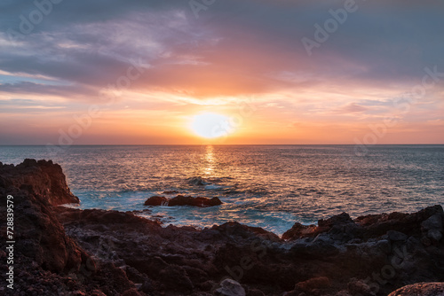 Beautiful landscape of a magnificient sunset over the Atlantic Ocean coastline in Fuerteventura island  on Las Palmas de Gran Canaria.