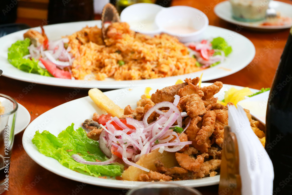 Peruvian Gastronomy: Fish Chicharrones and Seafood Rice Symphony Peruvian Gastronomy: Fish Chicharrones and Seafood Rice Symphony