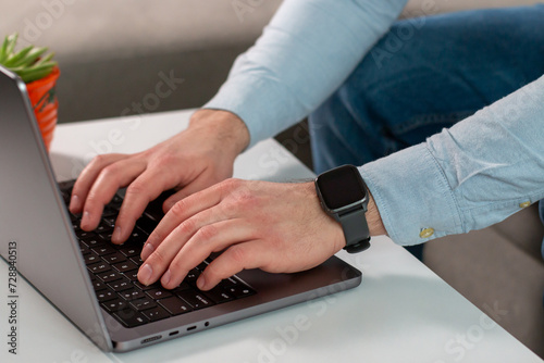 Closeup of  business man hands typing on a modern laptop. Online chatting  meeting website. Blogger  journalist writing new article.