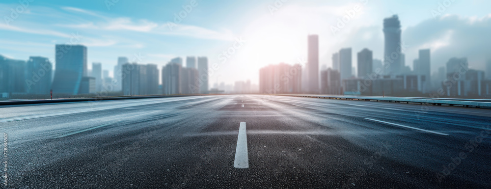 Empty Highway With City in Background Empty Highway With City in Background
