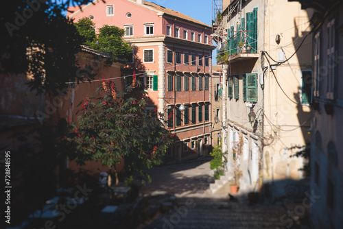 Fototapeta Naklejka Na Ścianę i Meble -  Corfu street view, Kerkyra old town beautiful cityscape, Ionian sea Islands, Greece, a summer sunny day, pedestrian streets with shops and cafes, architecture of historic center, travel to Greece