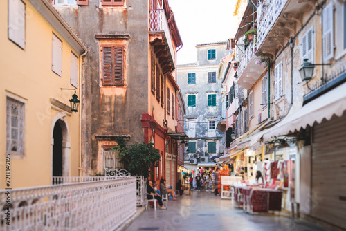 Corfu street view, Kerkyra old town beautiful cityscape, Ionian sea Islands, Greece, a summer sunny day, pedestrian streets with shops and cafes, architecture of historic center, travel to Greece © tsuguliev