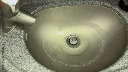 Old wash basin inside the bathroom of a Boeing 737-800 aircraft