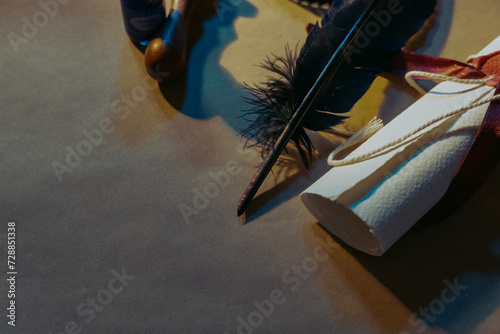 Fotografie Sleek black quill on the table next to the medieval scroll and brown seal stamp