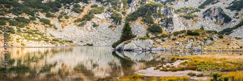 Long wide panorama of the Ribno Banderishko lake in summer day. Pirin mountains, Bulgaria. photo