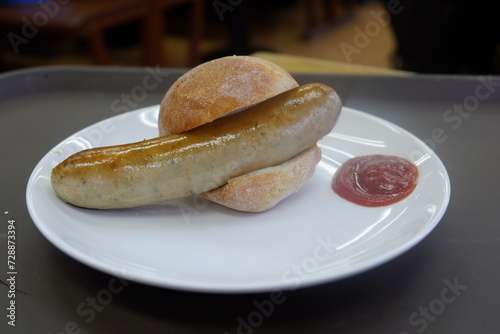 A bread with sausage and ketchup.JPG