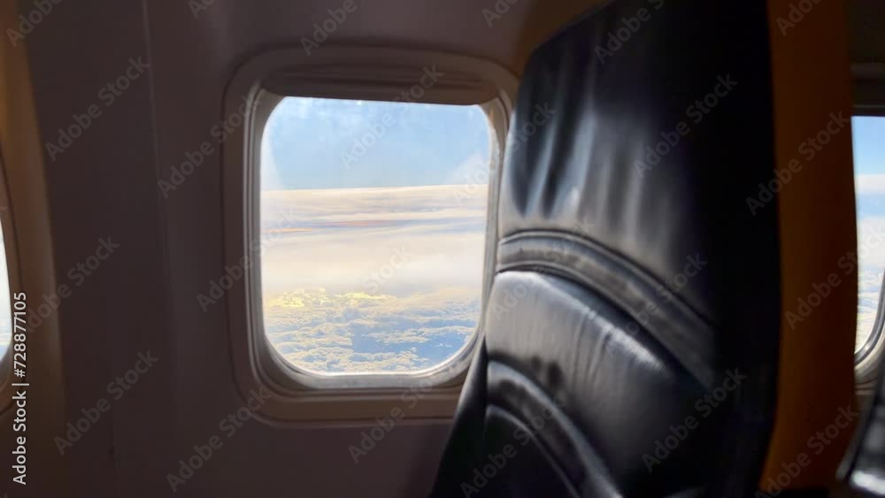 Airplane window view over a beautiful sunrise Airplane window view over a beautiful sunrise